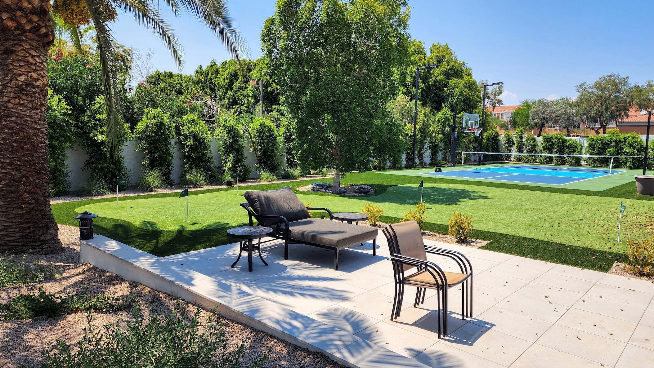 Pickleball court, putting green and ficus trees