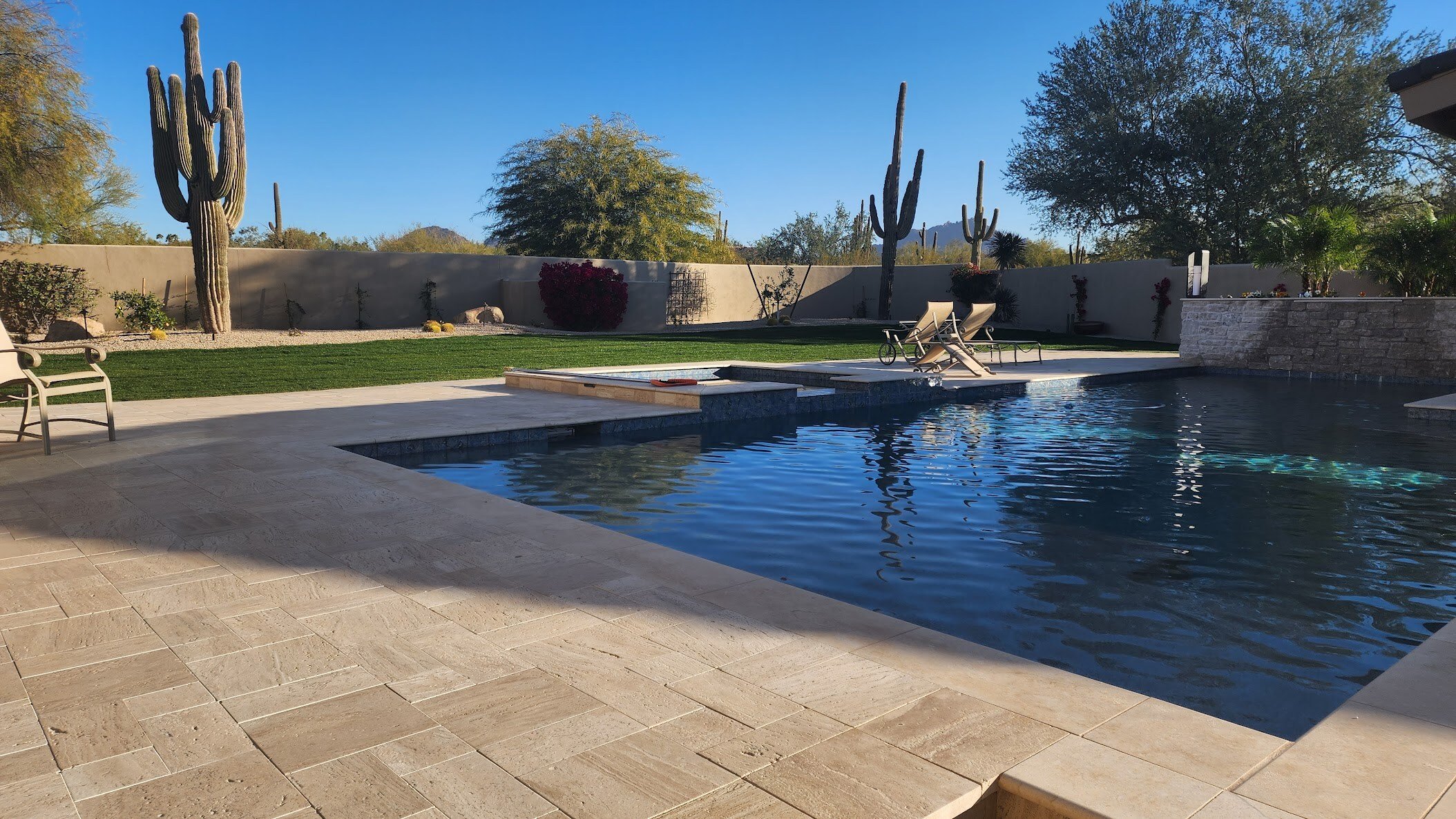 Pool, spa, landscaping and water feature